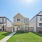 Exterior view of homes with front yards and porches at The Villas at Tamarron