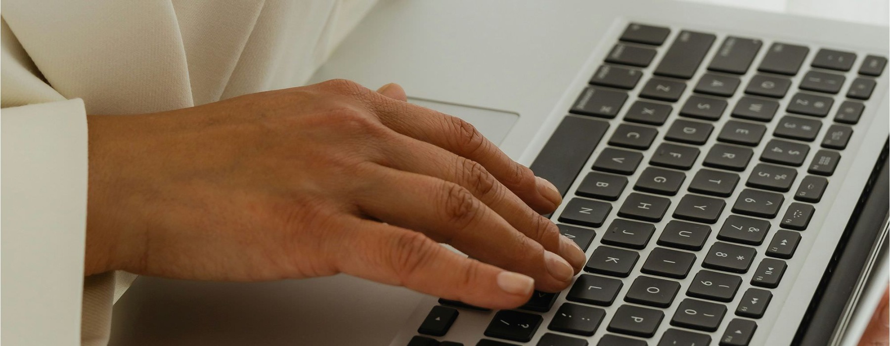 a person typing on a laptop