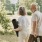 a man and woman walking with yoga mats